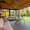 Terrace with comfortable couches and armchairs around table